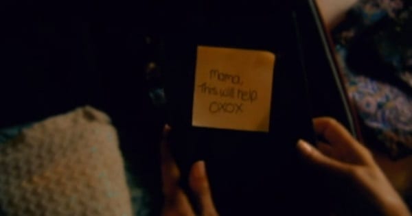 a post-it note on a book: mom I hope this helps