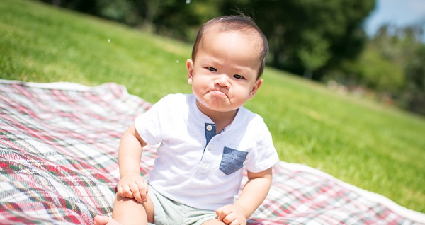 a cute baby showing anger