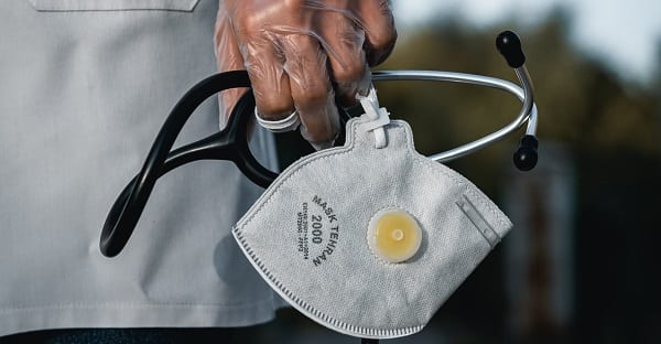 doctor holding PPE mask
