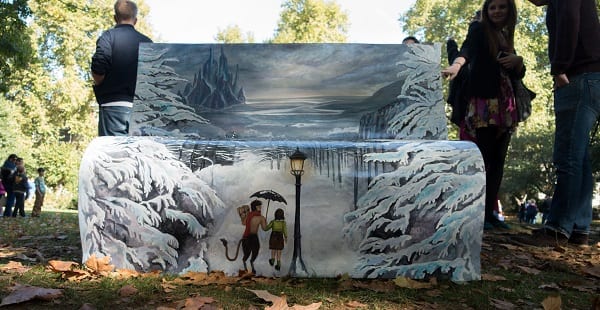 a bench painted with imagery from Narnia