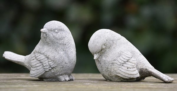 sad bird figurines