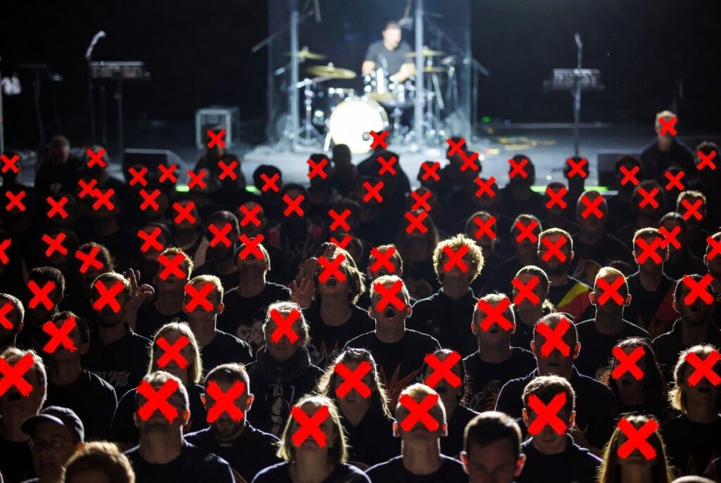 AI-generated picture of young adults at a concern, with most faces cross out in red.