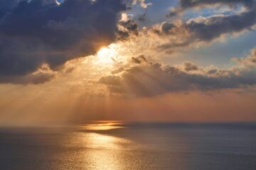 a lovely sunrise over calm waters